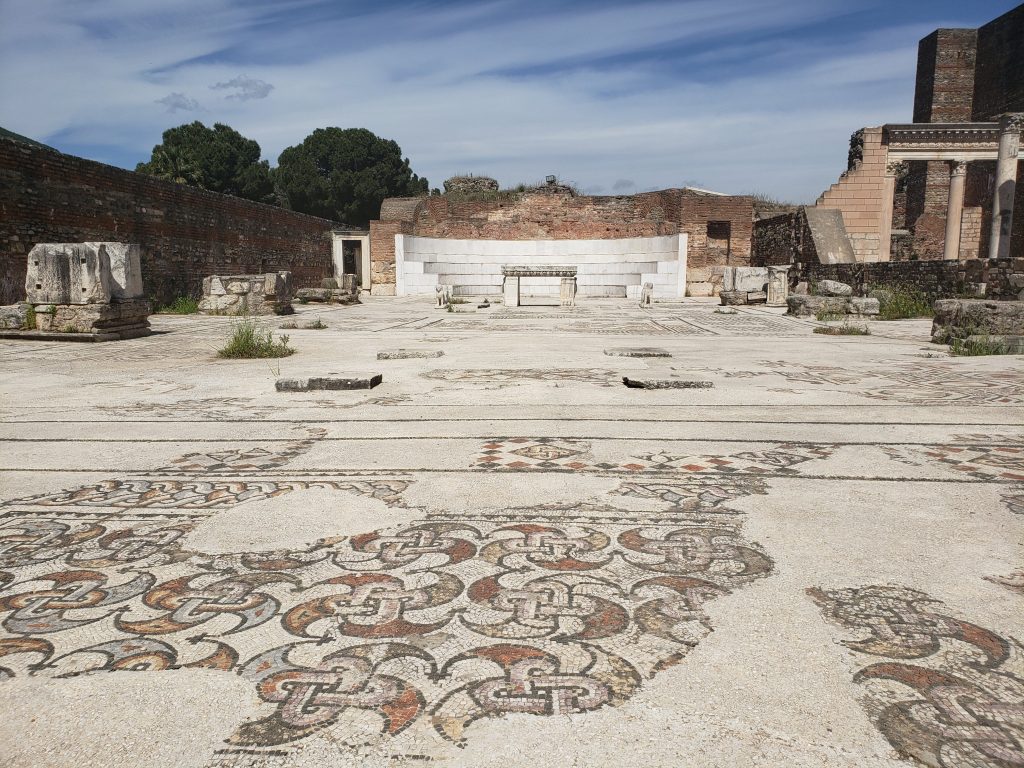 Now uncovered, the footprint of the synagogue is still intact, with large portions of its mosaic floor still visible. At one end, there is a large altar with curved alcove behind