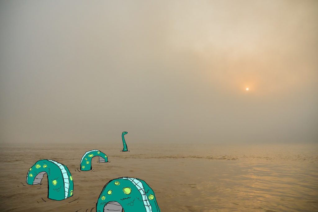 At sunset on Loch Ness, a green cartoon water serpent swims off into the sunset. Nessie never looked so beautiful.